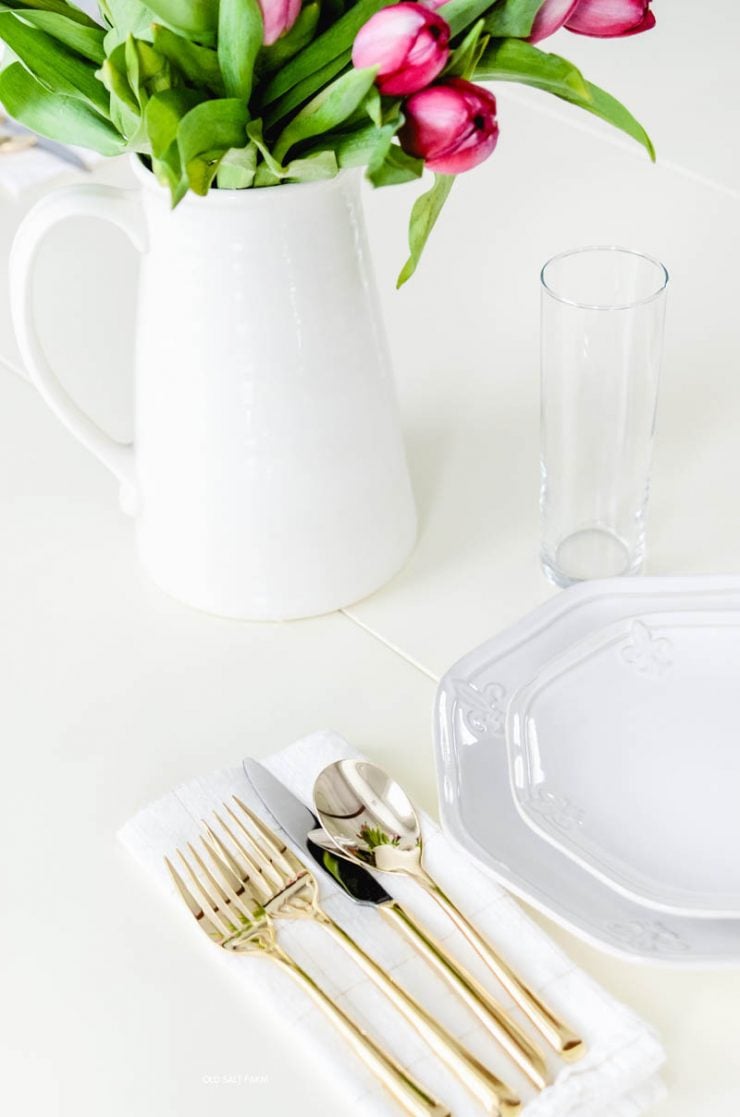 gold-flatware-white-dishes-tulips